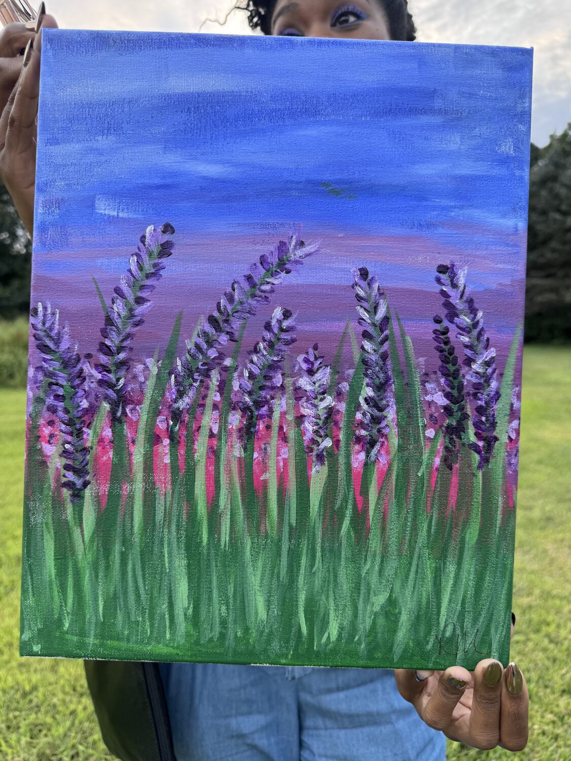 A finished lavender canvas held up at the end of the night